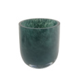 green patterned glass candle holder